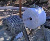 12.5 gauge, 4-point galvanized barbed wire, One Community